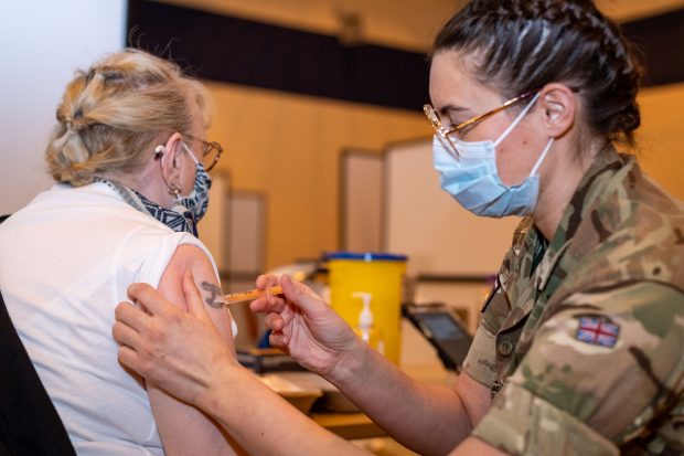 A vaxine is administered by military personnel