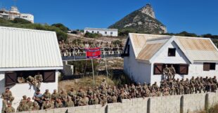 Military personnel from 9 Parachute Regiment posing for a group photo.