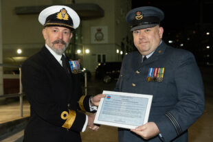 Flt Lt Caward receiving CBF Commendation